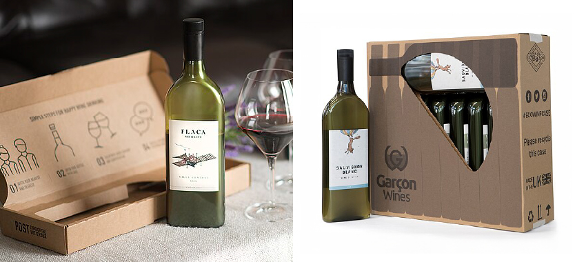Garçon wine bottle next to a branded box and a wine glass filled with wine